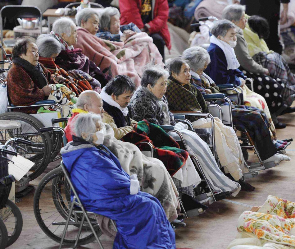 People on their wheelchairs rest at an evacuation centre in Kesennuma, March 16, 2011.