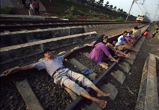 Electrified railway track in Rawa Buaya, Indonesia.